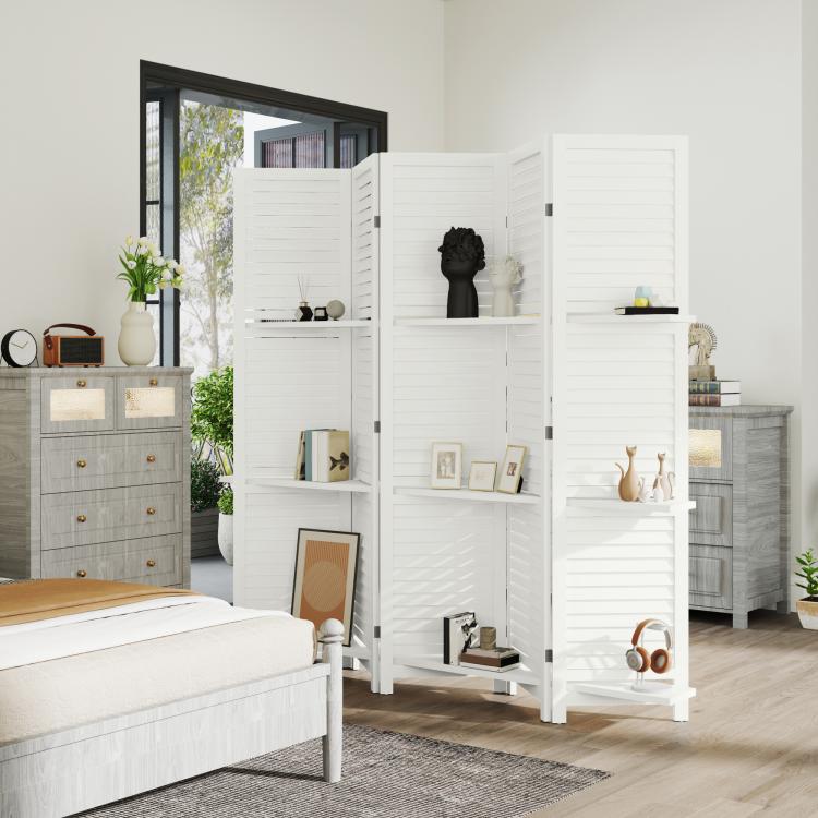 White slatted privacy screen divider standing in front of a bed and drawers, with shelves.