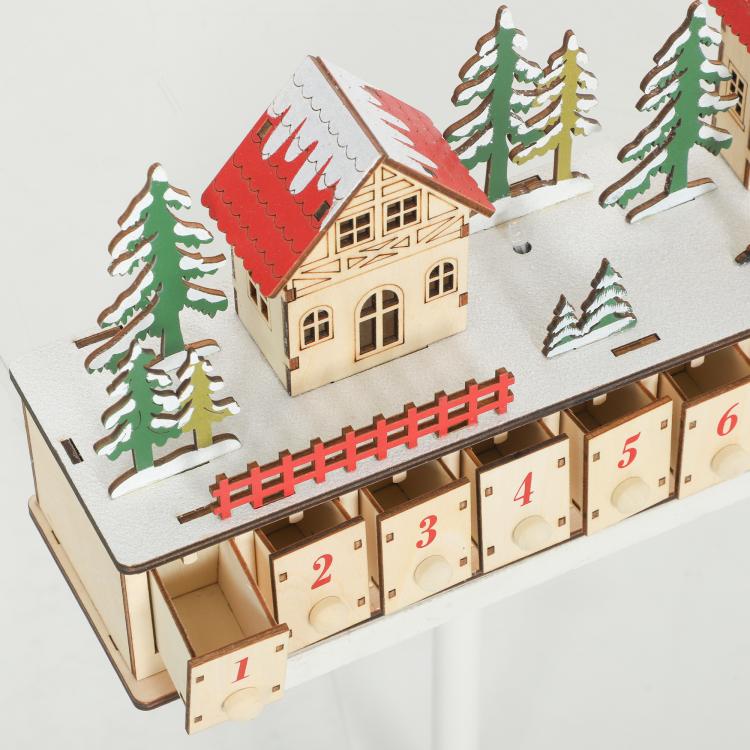 Wood-effect advent calendar with miniature house roof, trees, and numbered drawers 1 to 6