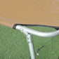 Tan folding pool chaise lounge with silver armrest and black fabric straps