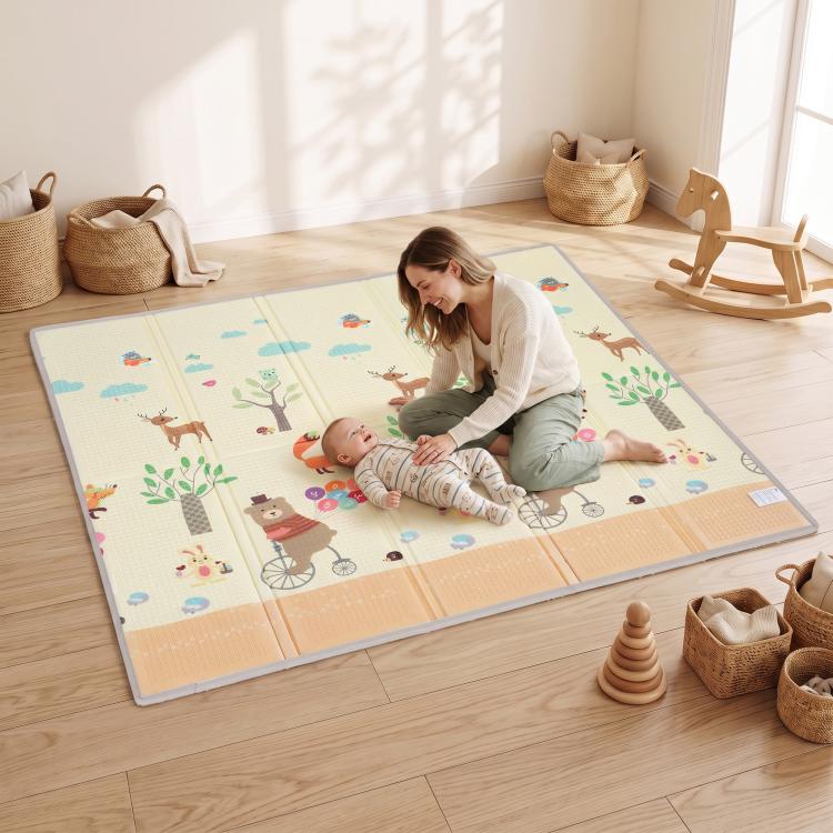 Forest animal reversible play mat on floor with padded surface, beige and blue