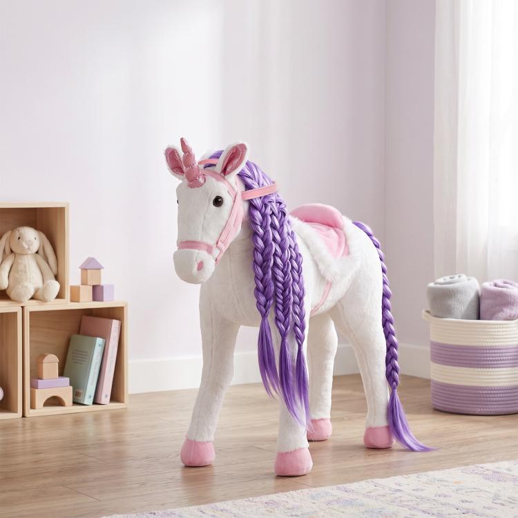 White plush ride-on horse toy standing with purple braided mane and pink trim