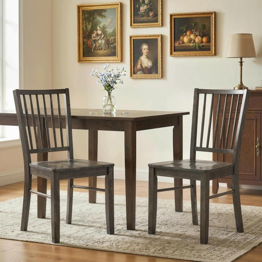 Charcoal gray armless dining chairs with tall vertical slat backrests and square wooden legs