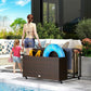 Mixed brown rattan organizer with wheels holding pool floats on an outdoor deck