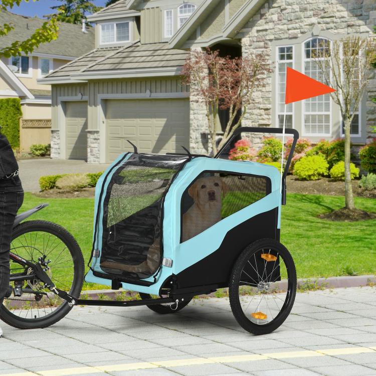 Blue pet stroller trailer on wheels with mesh side panels and raised handle