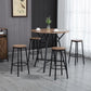 Bar height dining set: round table with four stools, black frames and wood-look tops.