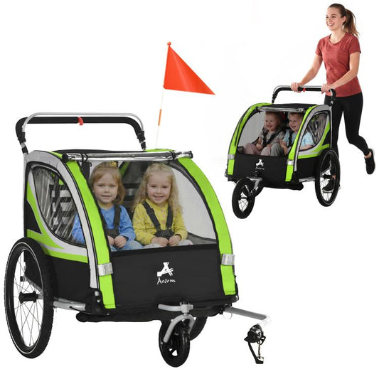 Green and black double-seat bike trailer with orange safety flag, two children seated inside