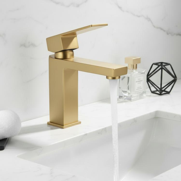 Brushed gold single-handle lavatory faucet mounted on countertop with spout.
