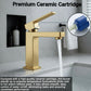 Brushed gold single-handle bathroom faucet with water flow and spout.