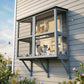 Gray two-level outdoor cat enclosure with mesh sides and cats on different levels
