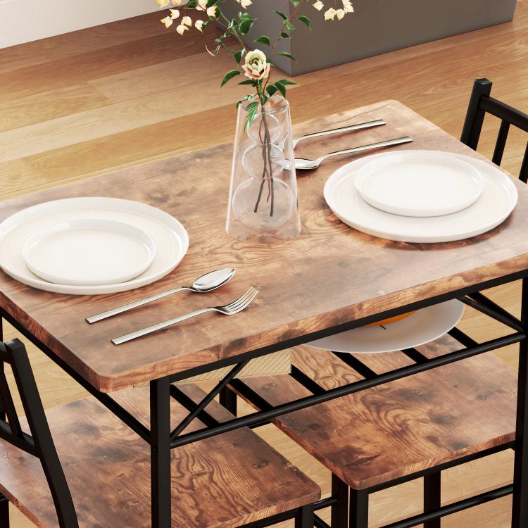 Wood-look dining table with black steel frame and storage rack, plus chair backs