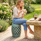 Teal ceramic garden stool with glazed lattice cutouts and rounded top