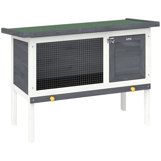 Outdoor elevated rabbit hutch with mesh side panel and dark hinged door, asphalt roof