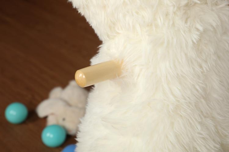 White plush alpaca rocking horse with wooden rocker arm detail