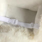 White plush alpaca rocking horse safety belt across seat