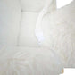 White plush rocking horse with white fabric safety belt strap