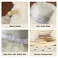 White plush alpaca rocking toy details: safety handle, belt, and wooden base