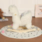 White plush alpaca rocking horse toy viewed from side on wooden rockers