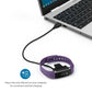 USB charging cable connected to a purple Fitbit Alta band and charging clip