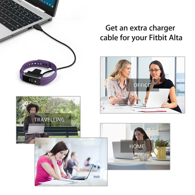 Fitbit Alta charging cable kit with purple band connected to black charging clip