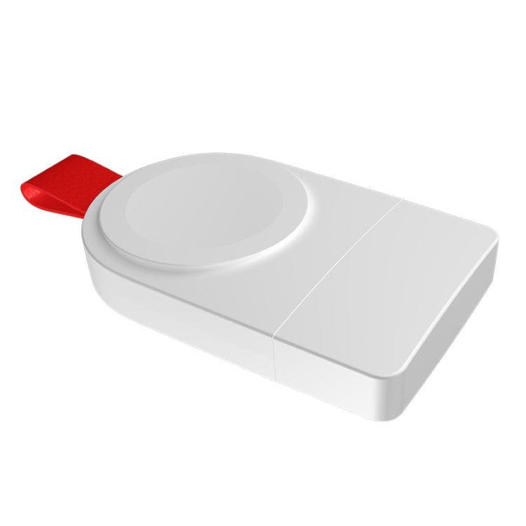 White wireless charging puck dock with red strap, angled view