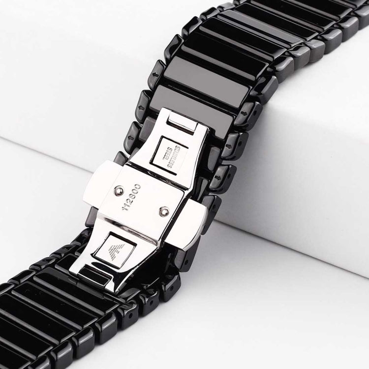 Black ceramic Apple Watch band with silver clasp and detailed link fasteners