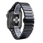 Black ceramic Apple Watch band close-up showing matte links and aluminum hardware