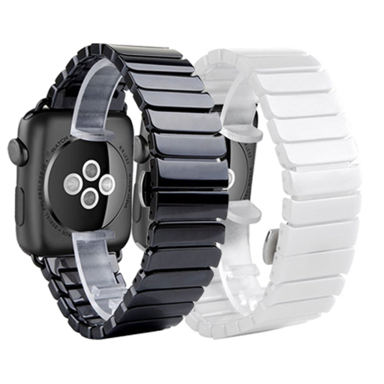 Black and white ceramic Apple Watch bands side by side with clasp and links
