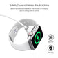 Magnetic charging puck attached to a smartwatch on a charging strap