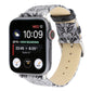 Grey thorn-pattern leather watch band with silver buckle, worn on a smartwatch