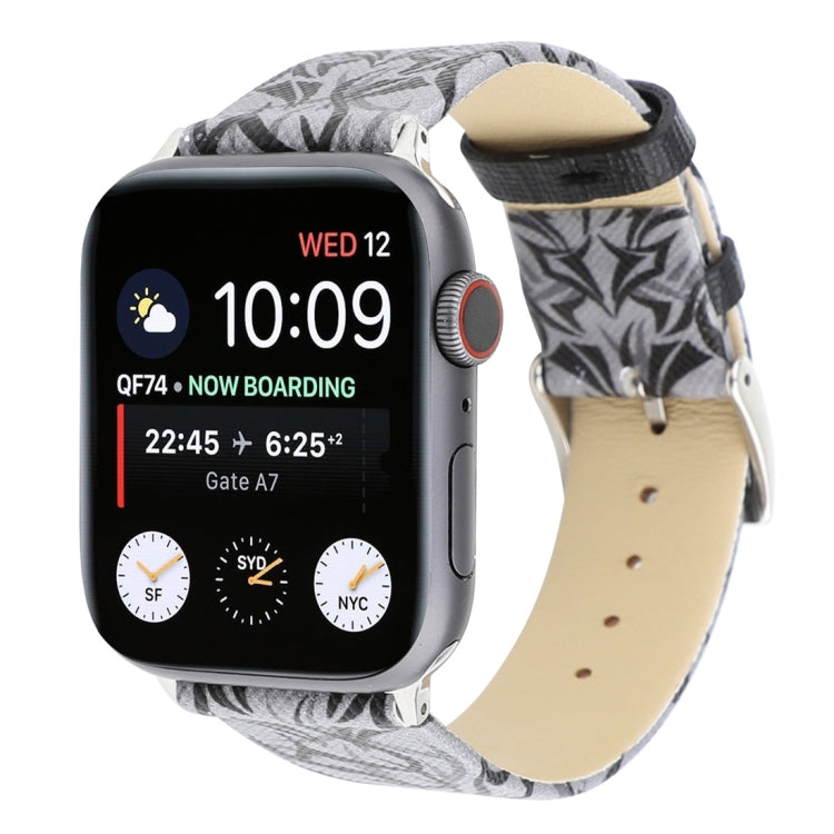 Grey thorn-pattern leather watch band with silver buckle, worn on a smartwatch