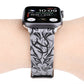 Grey thorn-pattern leather watch band with black stitching, fastened on a smartwatch