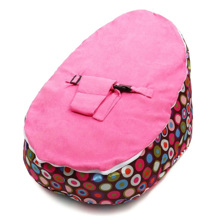Pink bean bag feeding bed cover with patterned base, padded top and black buckles