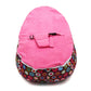 Pink bean bag feeding bed cover with rounded top, securing straps, and black buckle details