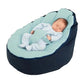 Blue bean bag cover with light aqua top and dark navy sides, baby lying inside