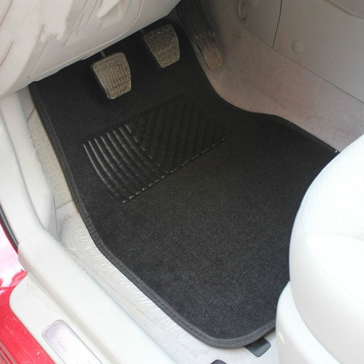 Black universal carpet floor mat for car footwell with ribbed traction channel