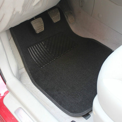 Black universal carpet floor mat for car footwell with ribbed traction channel