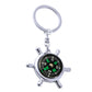 Rudder compass keychain with silver ring and multi-spoke compass wheel, black dial