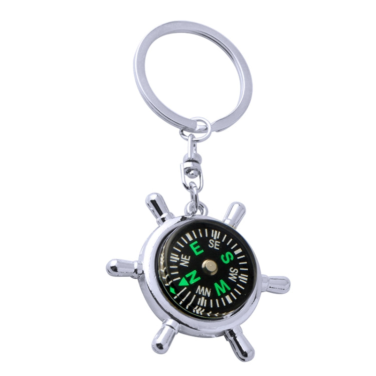 Rudder compass keychain with silver ring and multi-spoke compass wheel, black dial
