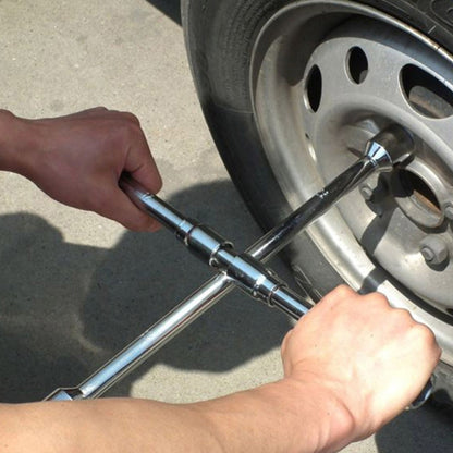 Foldable cross wheel wrench with socket ends, turning a wheel hub fastener