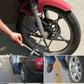 Foldable cross wrench turning wheel hub fasteners on a motorcycle wheel