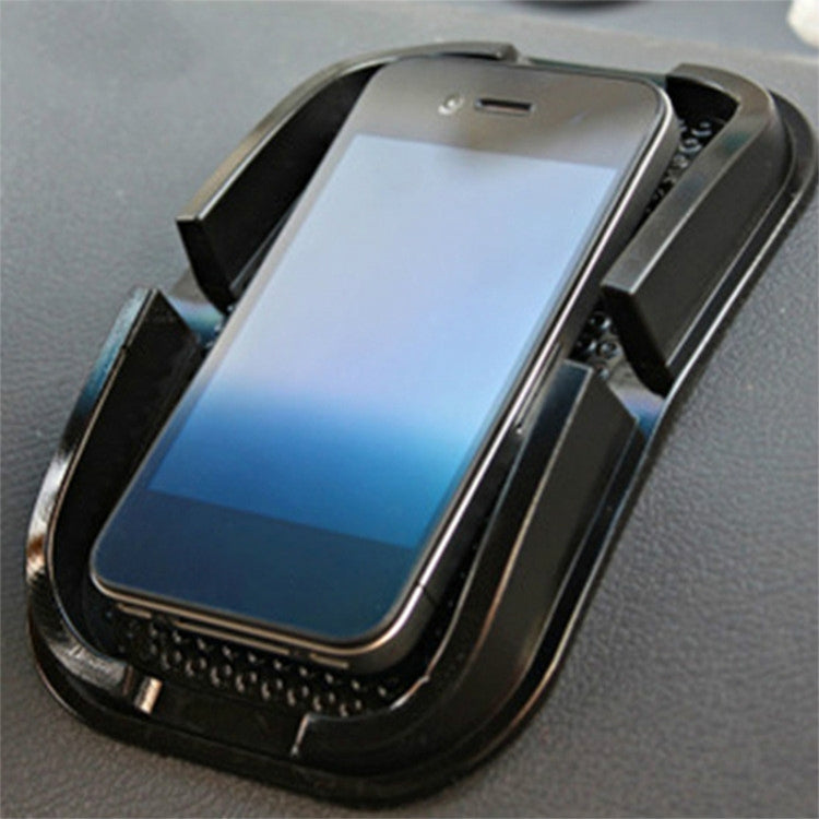 Black punctate phone slip mat with raised cradle and textured grip surface