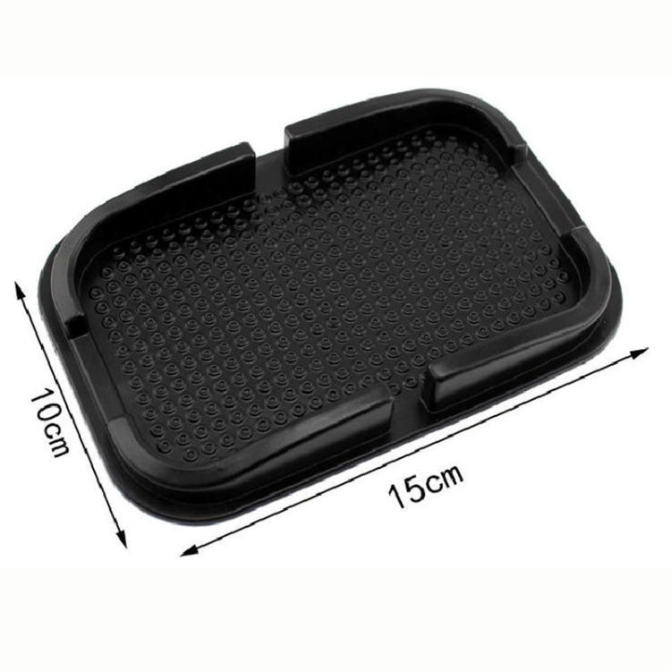 Black textured phone slip mat, 15 x 10 cm, with raised side edges