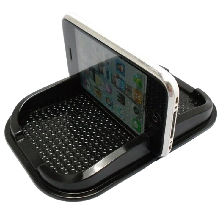 Black punctate phone slip mat with hinged phone cradle, textured base