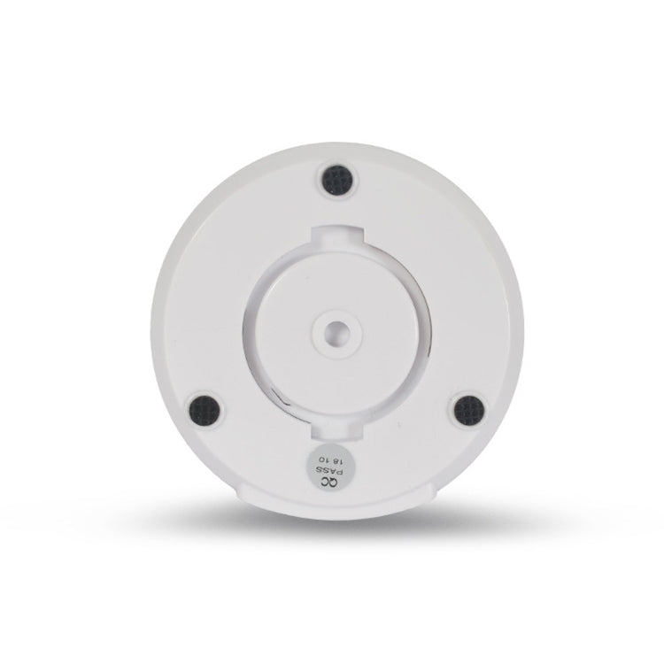 White wireless dome security camera top view with mounting base and circular contacts