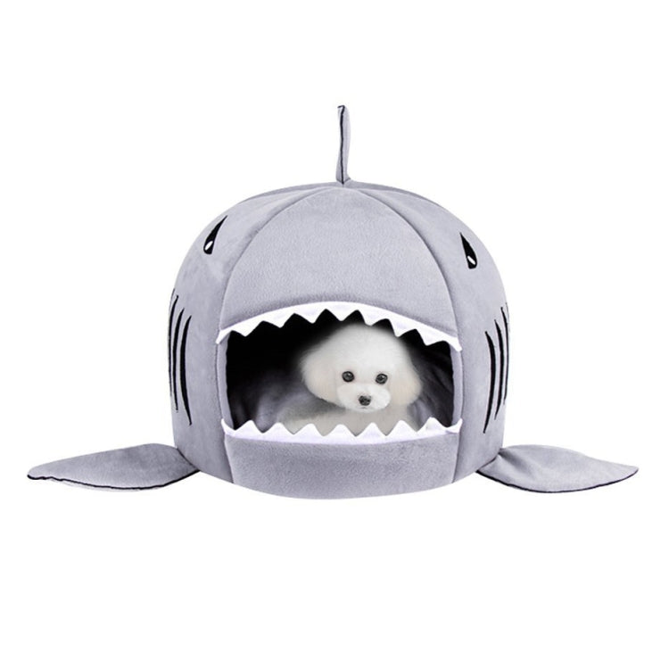 Grey shark-shaped pet nest bed with dangling top fin and cushioned interior