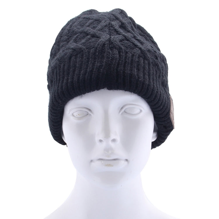Black cable-knit Bluetooth beanie hat with folded cuff and brown control patch