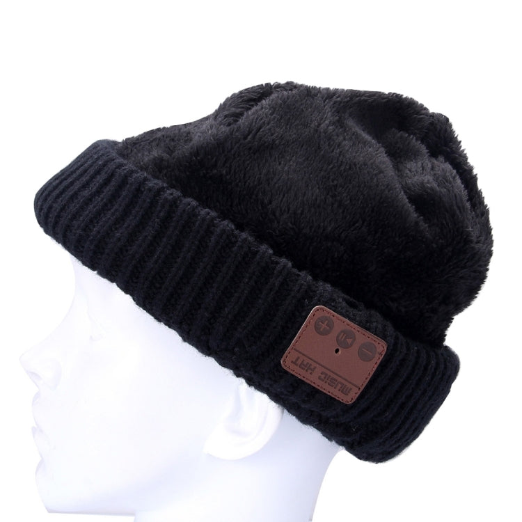 Black knitted Bluetooth beanie with fuzzy cuff lining and brown control patch
