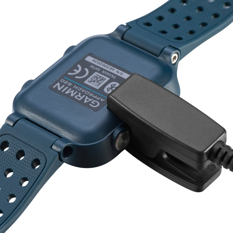 Blue watch band with charging clip attached to charging data cable