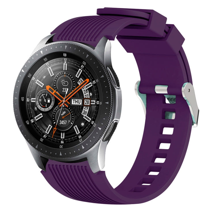Purple silicone watch band with vertical grain ridges and side buckle holes