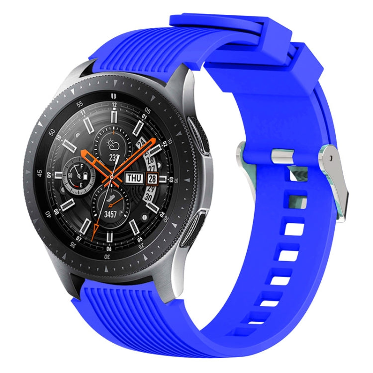 Blue silicone watch band with vertical grain ridges and side buckle holes